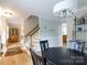 Elegant dining area with hardwood floors, stylish furnishings, and an open-concept layout at 211 Southfork Dr, Belmont, NC 28012