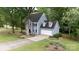 Beautiful two-story home with mature landscaping, large trees, and a well-manicured lawn at 211 Southfork Dr, Belmont, NC 28012
