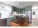 Open-concept kitchen with an island, modern appliances, and stylish finishes, perfect for cooking and entertaining at 211 Southfork Dr, Belmont, NC 28012