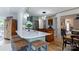 Modern kitchen featuring a long island with seating, stainless appliances, and wood floors at 211 Southfork Dr, Belmont, NC 28012