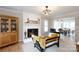 Cozy living room featuring a fireplace, hardwood floors, with adjacent dining room for seamless entertaining at 211 Southfork Dr, Belmont, NC 28012