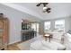 Open-concept living room flows into the kitchen with a comfortable seating area and ample natural light at 211 Southfork Dr, Belmont, NC 28012