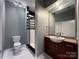 Bathroom with white tile floors and modern shower with a vanity at 2125 Southend Dr # 320, Charlotte, NC 28203
