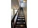 View of staircase with a window overlooking the front of the home at 2125 Southend Dr # 320, Charlotte, NC 28203