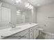 Bright bathroom with double vanity, white countertops, modern lighting, and tile floors at 215 Lake George Dr, Shelby, NC 28152