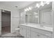 Well-lit bathroom featuring a double vanity and a walk-in closet at 215 Lake George Dr, Shelby, NC 28152