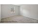 Cozy bedroom with plush carpeting and a sunny window at 215 Lake George Dr, Shelby, NC 28152