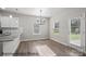Bright dining room featuring modern lighting, hardwood floors, and natural light at 215 Lake George Dr, Shelby, NC 28152