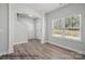 Bright foyer featuring hardwood floors, large window, and an open staircase at 215 Lake George Dr, Shelby, NC 28152