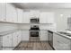 Bright kitchen with white cabinets, stainless steel appliances, and granite countertops at 215 Lake George Dr, Shelby, NC 28152