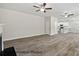 Open living space with modern wood-look flooring, connecting to a bright kitchen at 215 Lake George Dr, Shelby, NC 28152