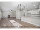 Open-concept living room featuring hardwood floors, a fireplace, and modern lighting at 215 Lake George Dr, Shelby, NC 28152