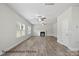 Spacious living room with wood-look flooring, fireplace, and ample natural light at 215 Lake George Dr, Shelby, NC 28152