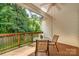 Inviting back deck featuring a table and chairs, perfect for enjoying the lush, green backyard at 2333 Wednesbury Ct, Kannapolis, NC 28083