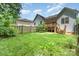 Spacious backyard featuring a well-maintained lawn, privacy fence, and lush landscaping at 2333 Wednesbury Ct, Kannapolis, NC 28083