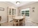 Dining room featuring natural light, tile floors, and stylish decor at 2333 Wednesbury Ct, Kannapolis, NC 28083