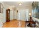 Bright foyer with hardwood floors, a grandfather clock, and a traditional style front entry door at 2333 Wednesbury Ct, Kannapolis, NC 28083