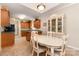 Open kitchen and dining area with tile floors, cabinetry, and appliances at 2333 Wednesbury Ct, Kannapolis, NC 28083