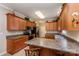 Well-equipped kitchen with wooden cabinets, stainless steel appliances, and a breakfast bar at 2333 Wednesbury Ct, Kannapolis, NC 28083