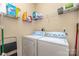 Laundry room with washer, dryer, and storage shelves for convenience at 2333 Wednesbury Ct, Kannapolis, NC 28083