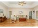 Comfortable living room with hardwood floors, a tray ceiling, and a neutral color palette at 2333 Wednesbury Ct, Kannapolis, NC 28083
