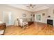 Open living room featuring hardwood floors, a cozy fireplace, and sliding doors to the back deck at 2333 Wednesbury Ct, Kannapolis, NC 28083