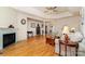 Cozy living room featuring hardwood floors, a fireplace, and seamlessly integrates adjacent living spaces at 2333 Wednesbury Ct, Kannapolis, NC 28083