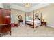 Main bedroom with a four-poster bed, ceiling fan, and ensuite bathroom at 2333 Wednesbury Ct, Kannapolis, NC 28083