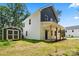 Spacious backyard with a storage shed complements this charming two-story home with two-tone facade at 25 Mickley Ave, Bessemer City, NC 28016