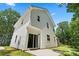 This modern home has white vinyl siding, a sliding glass door, and lush landscaping at 25 Mickley Ave, Bessemer City, NC 28016