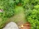 Aerial view of lush, private backyard space connected to a wooden deck at 255 South Academy St, Mooresville, NC 28115