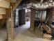 Unfinished basement with exposed brick, offering an opportunity for customization and additional living space at 255 South Academy St, Mooresville, NC 28115