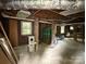 Spacious unfinished basement offering potential for customization and additional storage at 255 South Academy St, Mooresville, NC 28115