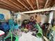 Cluttered basement filled with recreational equipment, offering storage and customization potential at 255 South Academy St, Mooresville, NC 28115
