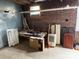 Partially cluttered basement offering potential for storage and customization in the home at 255 South Academy St, Mooresville, NC 28115