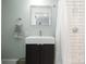 Modern bathroom features a sleek vanity, undermount sink, and subway tile shower at 255 South Academy St, Mooresville, NC 28115