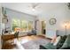 Bright bedroom featuring a desk area, a cozy lounge space, and access to a bathroom at 255 South Academy St, Mooresville, NC 28115