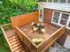 Wooden deck with furniture, wooden privacy screen and staircase at 255 South Academy St, Mooresville, NC 28115