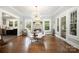 Elegant dining room with hardwood floors, modern chandelier, and access to other rooms at 255 South Academy St, Mooresville, NC 28115