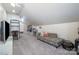 Spacious living room with plush seating, TV, and adjoining flex space at 255 South Academy St, Mooresville, NC 28115