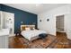 Cozy bedroom features an accent wall, rug, and lots of natural light at 255 South Academy St, Mooresville, NC 28115