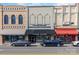 Street view highlighting commercial buildings with unique architectural facades and parked cars at 255 South Academy St, Mooresville, NC 28115