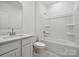 Bright bathroom features a shower-tub combo with white finishes at 2592 Blue Sky Meadows Dr, Monroe, NC 28110