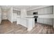 Well-lit kitchen featuring gray cabinets, white countertops, a kitchen island and stainless steel appliances at 2592 Blue Sky Meadows Dr, Monroe, NC 28110