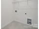 Functional laundry room with tile floors and essential hookups, ready for appliances and organization at 2592 Blue Sky Meadows Dr, Monroe, NC 28110