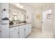 Bathroom with vanity and granite countertop plus views to an en suite shower at 2658 Manor Stone Way, Indian Trail, NC 28079