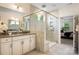 Modern bathroom with glass enclosed shower, granite countertops, and double vanity sinks at 2658 Manor Stone Way, Indian Trail, NC 28079
