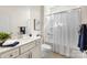 Bathroom with marble vanity, framed mirror, tile floor, and shower-tub combination at 2658 Manor Stone Way, Indian Trail, NC 28079