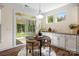 Bright dining area with outside views and seamless transition to screened porch at 2658 Manor Stone Way, Indian Trail, NC 28079