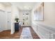 Inviting front entrance with hard wood floors and decorative wainscoting at 2658 Manor Stone Way, Indian Trail, NC 28079
